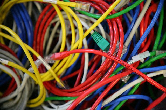 A bundle of colorful ethernet cables tangled together in a ball.